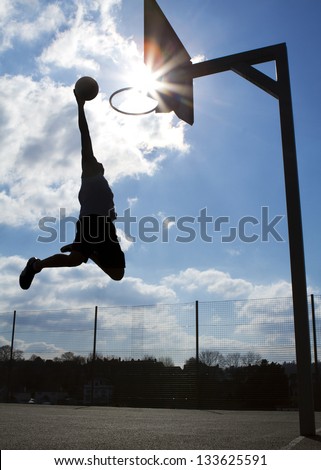 Basketball Player Dunk Silhouette Royalty-Free Stock Photo #133625591