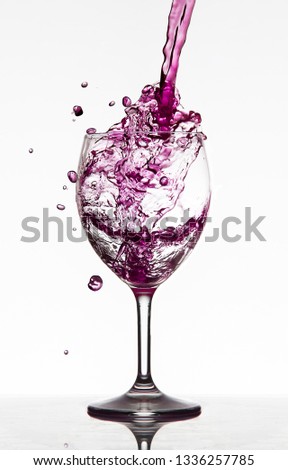 Spilled wine glass splashing out