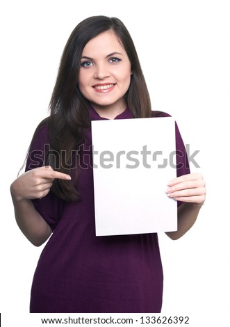 Attractive young woman in a dress. Woman holds a poster and points to him. On  a white background
