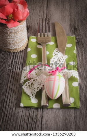 Easter table setting with daffodil and cutlery. Holidays background