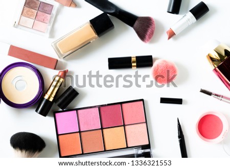 Set of decorative cosmetics blush,powder,mascara and lipstick on white background.