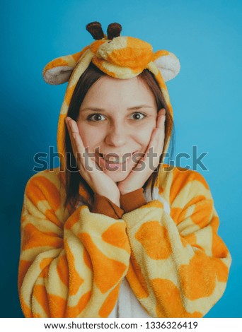 girl in a bright children's pajamas in the form of a kangaroo. emotional portrait of a student. costume presentation of children's animator. 
