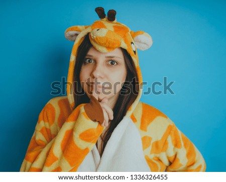 girl in a bright children's pajamas in the form of a kangaroo. emotional portrait of a student. costume presentation of children's animator. 