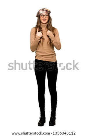 Full-length shot of Young woman with beret with surprise facial expression on isolated white background