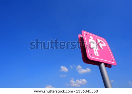 Lady Parking sign on blue sky background.