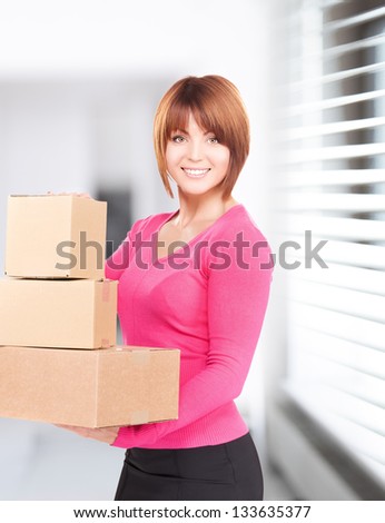 picture of businesswoman with parcels in office