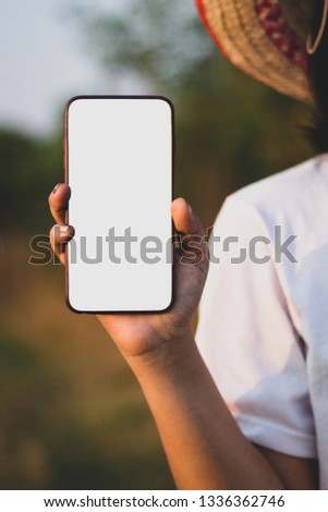 White smartphone screen and blurred background.