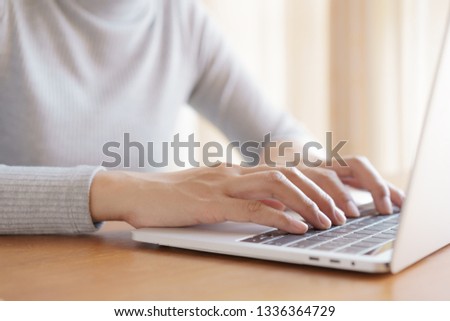 Asian woman  using a laptop, business women are working with notebook in office