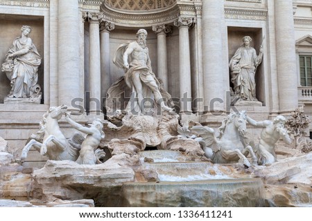 Close up picture of the Trevi Fountain, beautiful marble sculpture and the flowing water in Rome, Italy