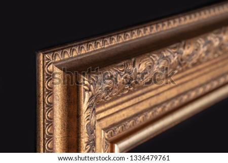 Classic frame for paintings with stucco on a black background