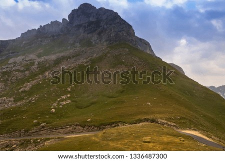 Mountain landscape in the autumn cloudy day. Mountains at sunset under the clouds. Blurred background and soft focus.