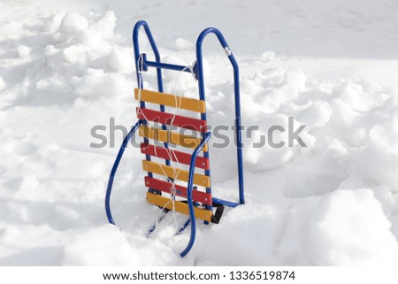 sledding in the snow, sledding