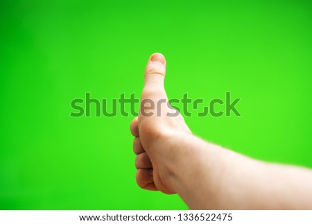 Male hand showing thumbs up. Chroma key. Place for your advertisement.