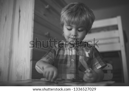 Education and hobby. Painter child play with coloring book. Childhood and happiness, learning. Kid or blonde happy boy paint with felt pen. Small boy child drawing with colorful marker pen.