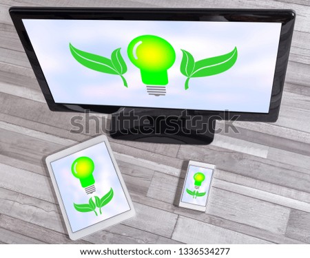Green energy concept shown on different information technology devices