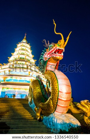 Beautiful dragon sculpture at night with dark sky background, Wat Huay Pla Kang, Chiang Rai, northern of Thailand.
