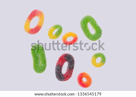 Colorful jellies on white background. Group of sugar jelly circles. Tasty treats for kids.