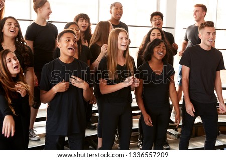 Male And Female Students Singing In Choir At Performing Arts School Royalty-Free Stock Photo #1336557209