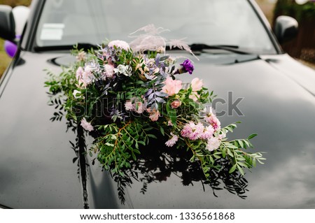 Wedding car with beautiful decorations. Flower decor.