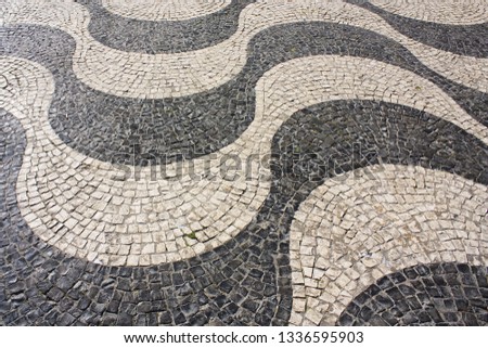 Traditional pattern cobblestone pavement (calçada portuguesa) in Belem, Lisbon, Portugal