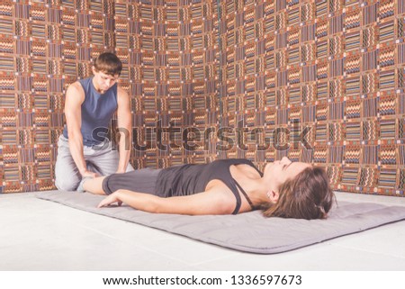 the man and woman on the floor Thai yoga massage, stretching and gymnastics, sports and health