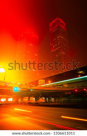 High-rise buildings and viaducts in the financial district of the city, night view of Beijing, China.