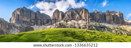 Sass Pordoi and Sella - alpine range in Trentino-Alto Adige Italy banner stitched panorama