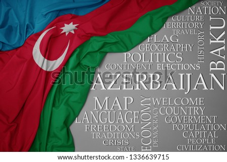 waving colorful national flag of azerbaijan on a gray background with important words about country . concept