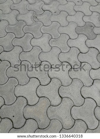 Surface texture of grey cement tiles jigsaw ground