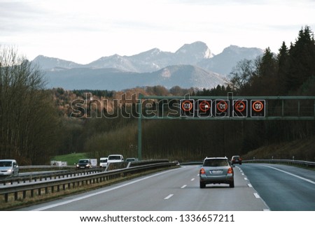 The road in Munich, Germany with a beautiful view of mountain and pine forest.