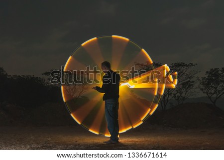 Indonesian people standing isolated with yellow circle of light