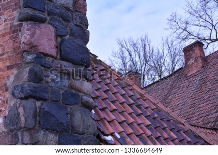 Chimney in the foreground on the roof