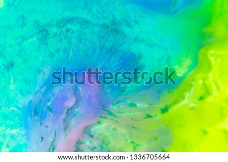 Colorful paint spreads background.