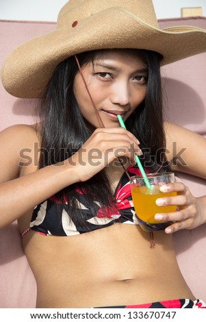 young woman drinking juice