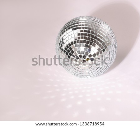 beautiful disco ball on yellow background isolated.