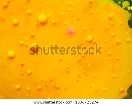 Abstract background of yellow glittering bubbles. Close up macro shot. Blurred background. Selective soft focus. Yellow universe, abstract background. Glittering spheres, abstract pattern