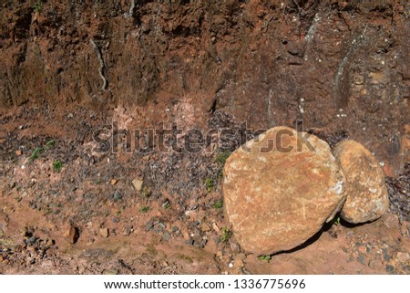 Two stones cut piece from rock 