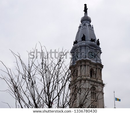 Close-up photo of Philadelphia City Hall main tower. Winter time, cloudy day.