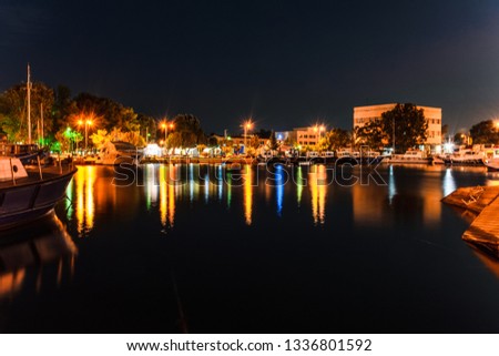 Night view of port of Elefsina with colorful light water reflections. Long exposure night picture at port of Elefsina in Attica, Greece.