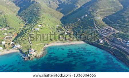 Aerial drone photo of famous and picturesque turquoise double beach of Flabouria with small beautiful orthodox church of Panagia Flabouriani in island of Kythnos at spring, Cyclades, Greece
