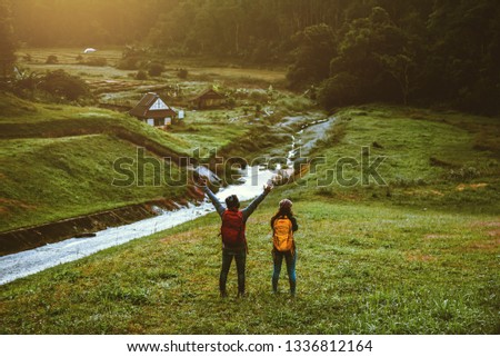 Couples asian Travel, take pictures of nature landscape the beautiful sunrise at Pang-ung.