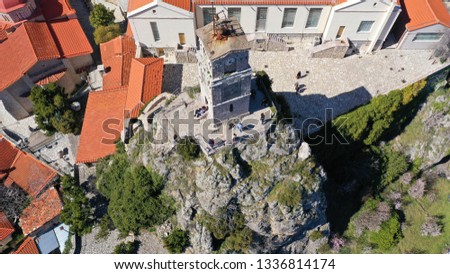 Aerial drone photo from famous and picturesque village of Arachova built on the slope of Parnassus mountain with traditional character at spring, Voiotia, Greece