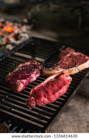 Raw beef meat on the grill