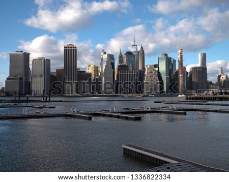 View of Riverside Park next to the city skyline at winter day from the Hudson River. Brooklyn Heights view of Manhattan buildings. 