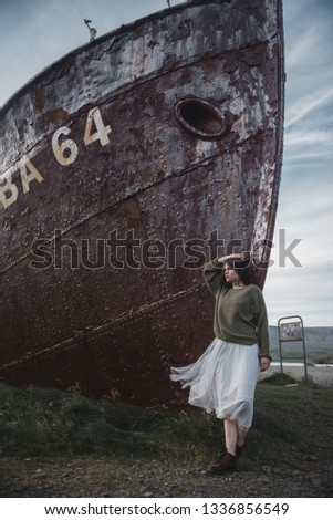 girl at the abandoned ship in white dress