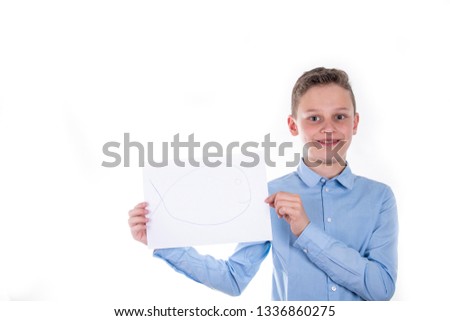 boy in blue shirt holding up an empty child on white background