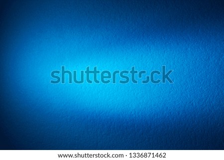 Blue blurred background and light blue wide beam of light
