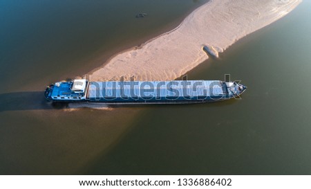 Aerial view of a barge hanging on a Danubian reef (shipwreck on a gravel bar)