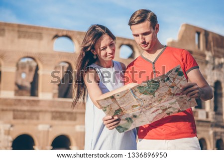 Happy family in Europe. Romantic couple in Rome over Coliseum background. Italian european vacation