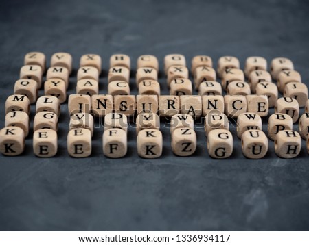 Wooden blocks with the word insurance
